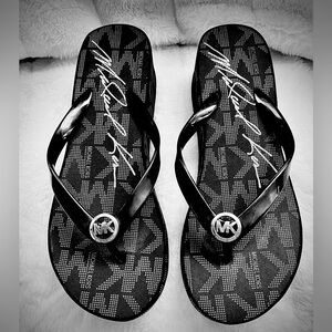 Designer Michael Kors black wedge flip flop. Size 7